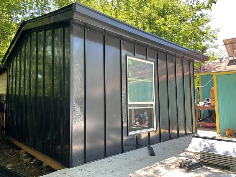 Black standing seam metal wall panels for Roof Inspection in Houston