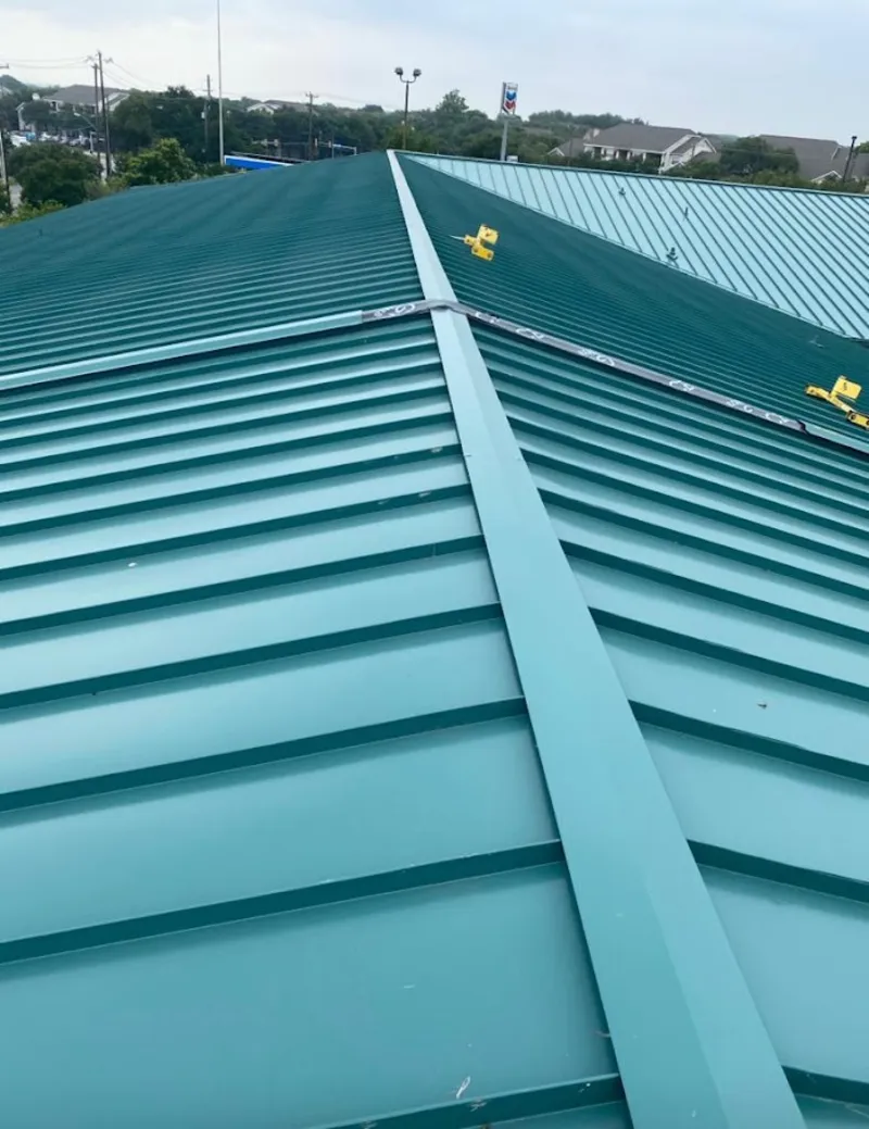 Green commercial metal roof ridge and valley for Metal Roof Repair in Houston